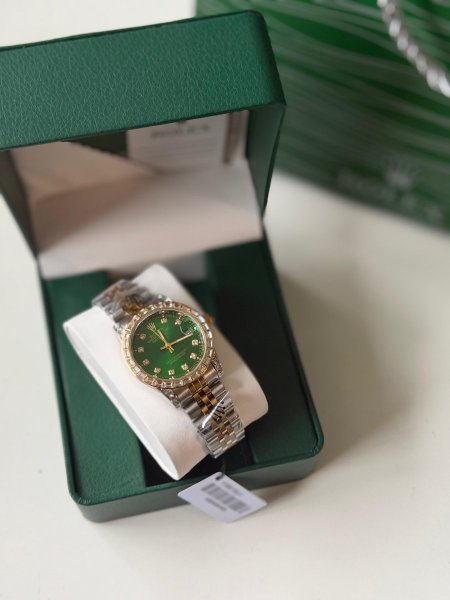 ساعة روليكس ارضية خضرا هاردوير مكس بين الذهبي والسلفر