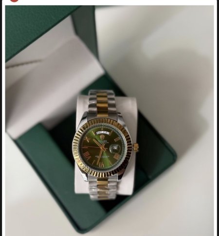 ساعة روليكس  ارضية اخضر  الهاردوير مكس بين الذهبي والسلفر
